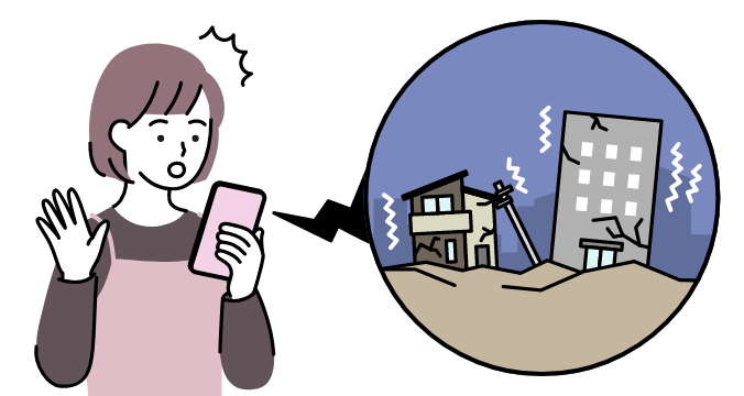 女性が緊急速報エリアメールを受信する様子